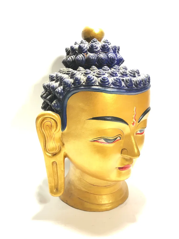 Statua volto di Buddha dorato